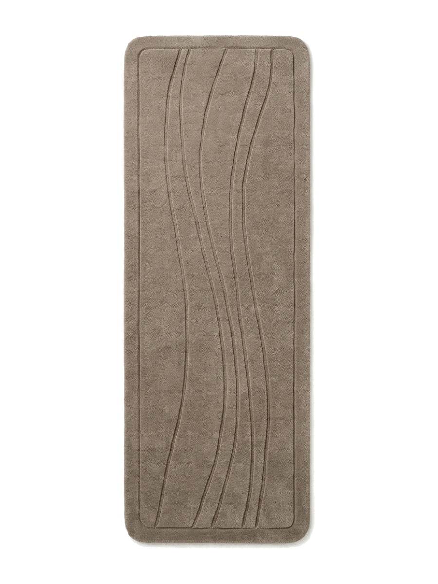 Taupe Wavy Line Runner Rug in a solid taupe tone with carved flowing lines, rounded corners and a raised border