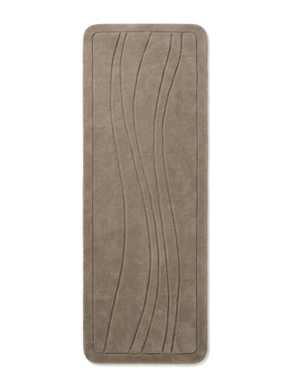 Taupe Wavy Line Runner Rug in a solid taupe tone with carved flowing lines, rounded corners and a raised border