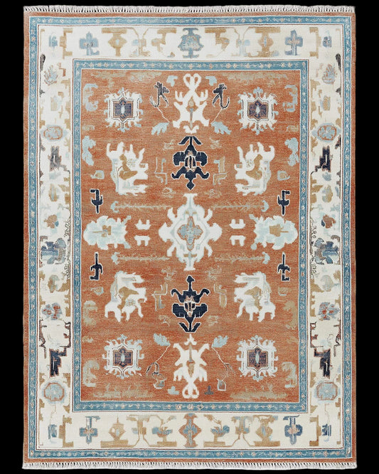 Hand-tufted terracotta Oushak rug with Southwestern geometric patterns and wool texture