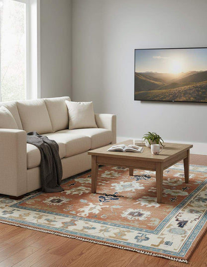 Hand-tufted terracotta Oushak rug with geometric medallions in southwestern boho style