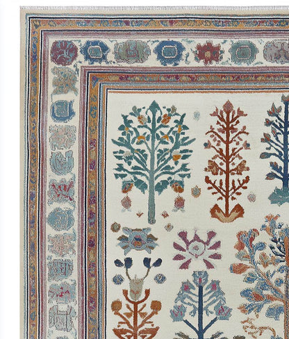 Hand-tufted terracotta Oushak wool rug with geometric Southwestern medallion pattern and earthy color palette