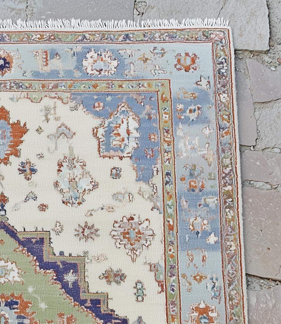 Terracotta Oushak wool rug with light blue floral oriental design and intricate hand-knotted craftsmanship