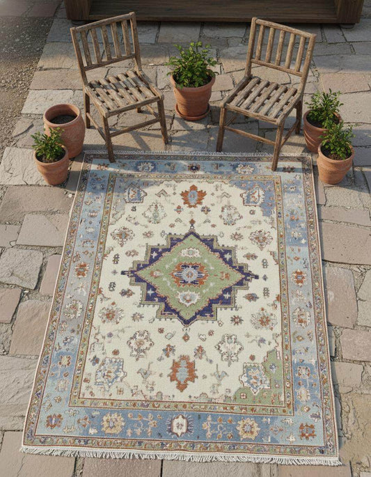Terracotta Oushak wool rug with light blue floral and geometric patterns, hand-knotted oriental carpet.