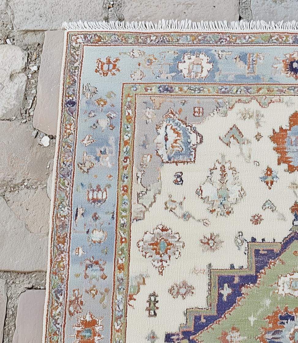 Terracotta Oushak wool rug with light blue floral patterns and intricate hand-knotted design