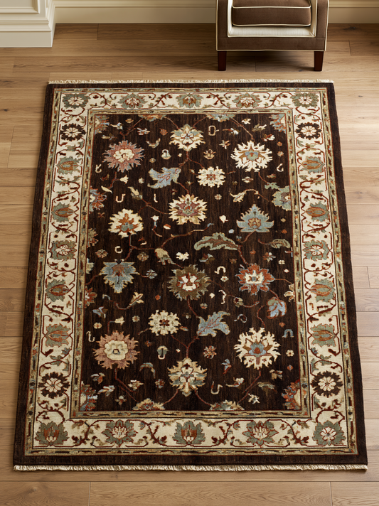 Oushak Hand Knotted Rug in chocolate brown wool, with multicoloured floral motifs and a wide ivory palmette border.